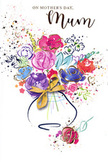 On this Mother's Day card, a lively watercolour bouquet bursts into view, echoing the relaxed elegance of fresh flowers gathered from Surrey's parks and village borders. The arrangement is painted in an impressionistic style, with petals and leaves suggested through washes of colour rather than strict outlines. At the centre, lush cerise and deep pink blooms form a warm, glowing heart, their layered tones hinting at depth and soft texture. Around them, gentle blues, violets, and lavender strokes calm the palette, reminiscent of early spring skies above Surrey's rolling landscapes. Small hints of apricot and pale peach peek through, adding a tender warmth that keeps the design from feeling too cool. Fine indigo lines meander through the composition, giving just enough structure to suggest stems and foliage while maintaining a relaxed, free-spirited feel. The white background remains open and bright, punctuated by playful splashes of colour and tiny heart shapes that drift like confetti or scattered petals on a garden path. Throughout the bouquet, delicate touches of gold outline selected petals and dot the surrounding space, shimmering subtly as if catching the last rays of daylight through a window. A softly painted vase anchors everything at the base, its rounded shape and gentle shading evoking a familiar household piece that has held many cherished arrangements. Although there is no printed text, the card radiates warmth, affection, and quiet celebration, perfectly suited to accompany a real Mother's Day bouquet delivered anywhere across Surrey, from bustling town centres to peaceful country lanes.